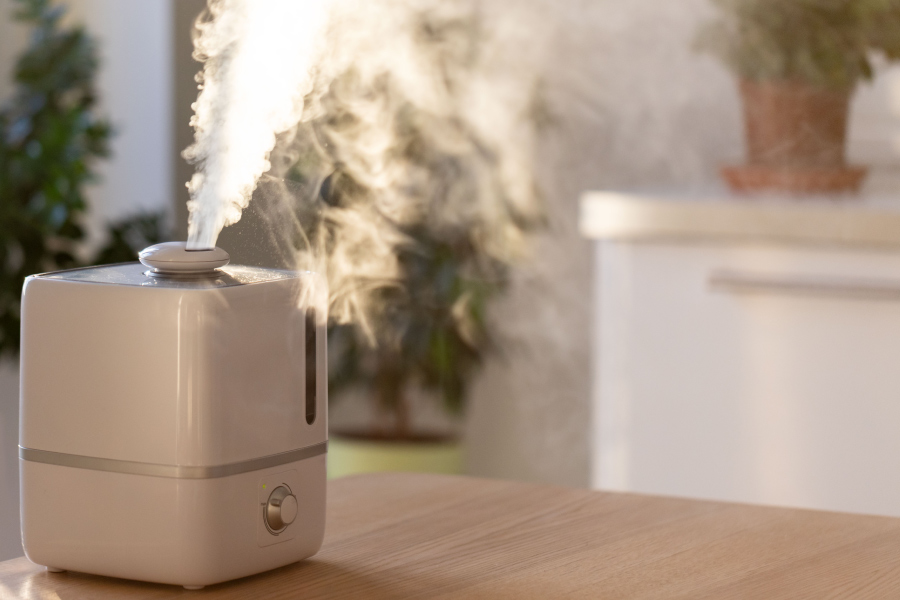 Humidifier on table blows out mist